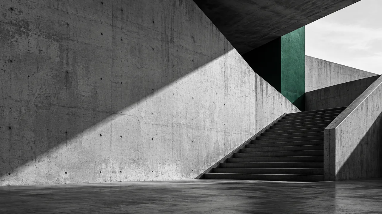 Precise angular concrete stairs rising through a building